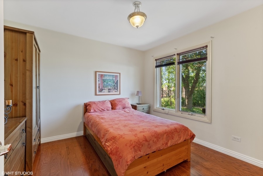 120 Chestnut Road Northbrook, IL 60062 - Photo 10 of 22 a bedroom with a bed and a window