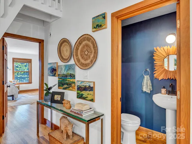 a bathroom with a sink mirror and vanity