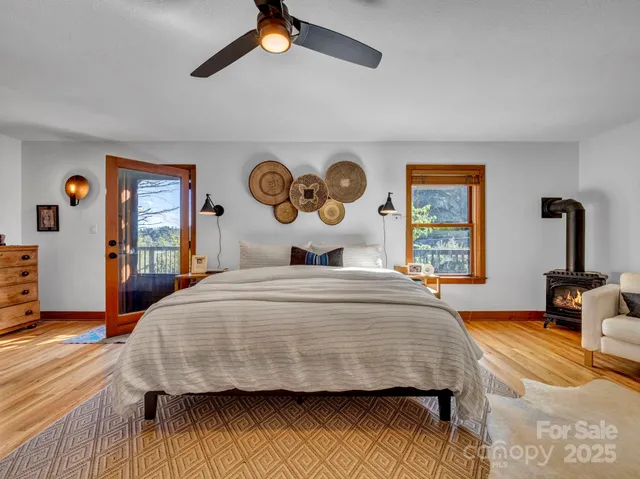 a living room filled with furniture and a large window