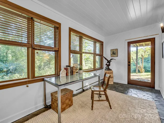 a view of a livingroom with furniture and windows