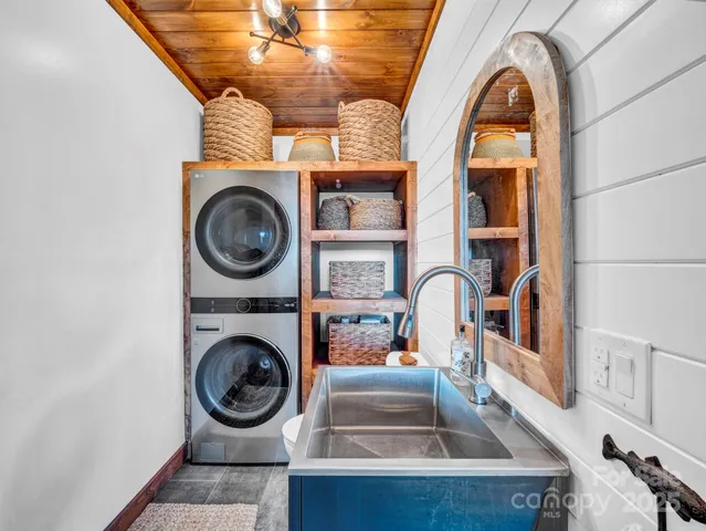 a room with furniture and a potted plant