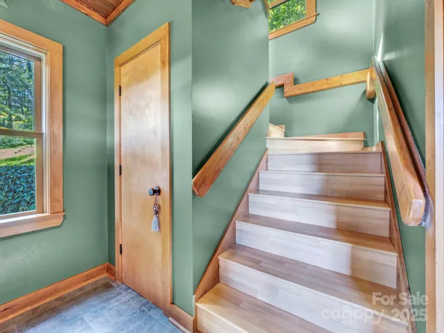 a living room with furniture and a garden