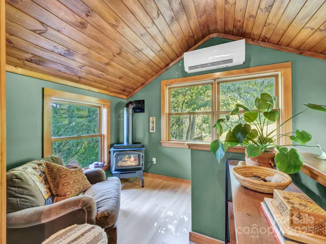 a bedroom with a bed and a outer view