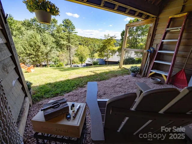 a view of a backyard with seating area
