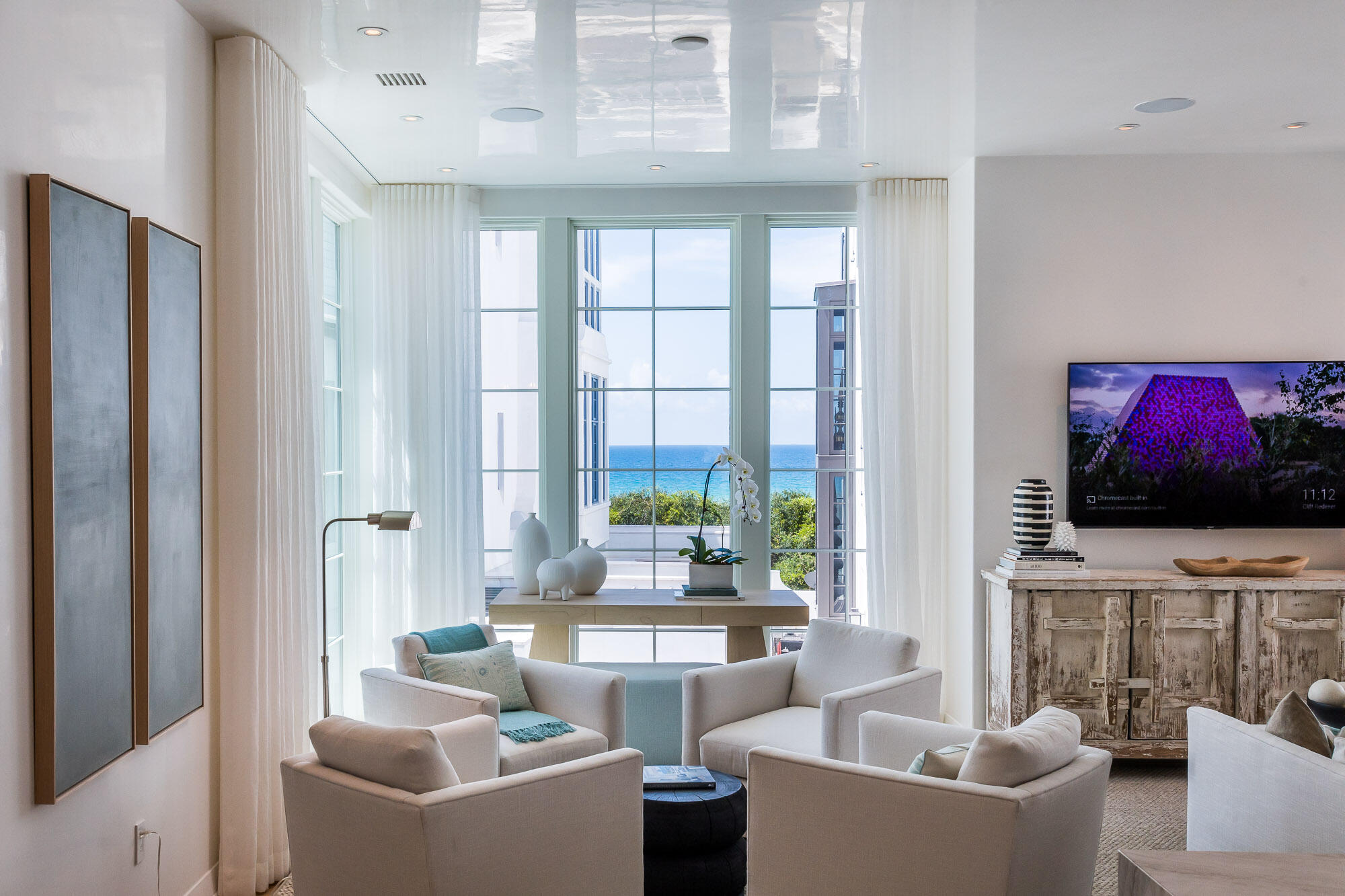 23 Sea Venture Alley, Unit MM6 Inlet Beach, FL 32461 - Photo 25 of 82 a living room with furniture a large window and a flat screen tv