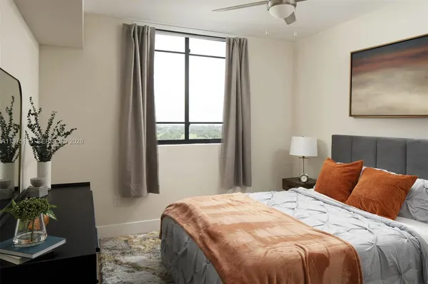 a bedroom with bed and window