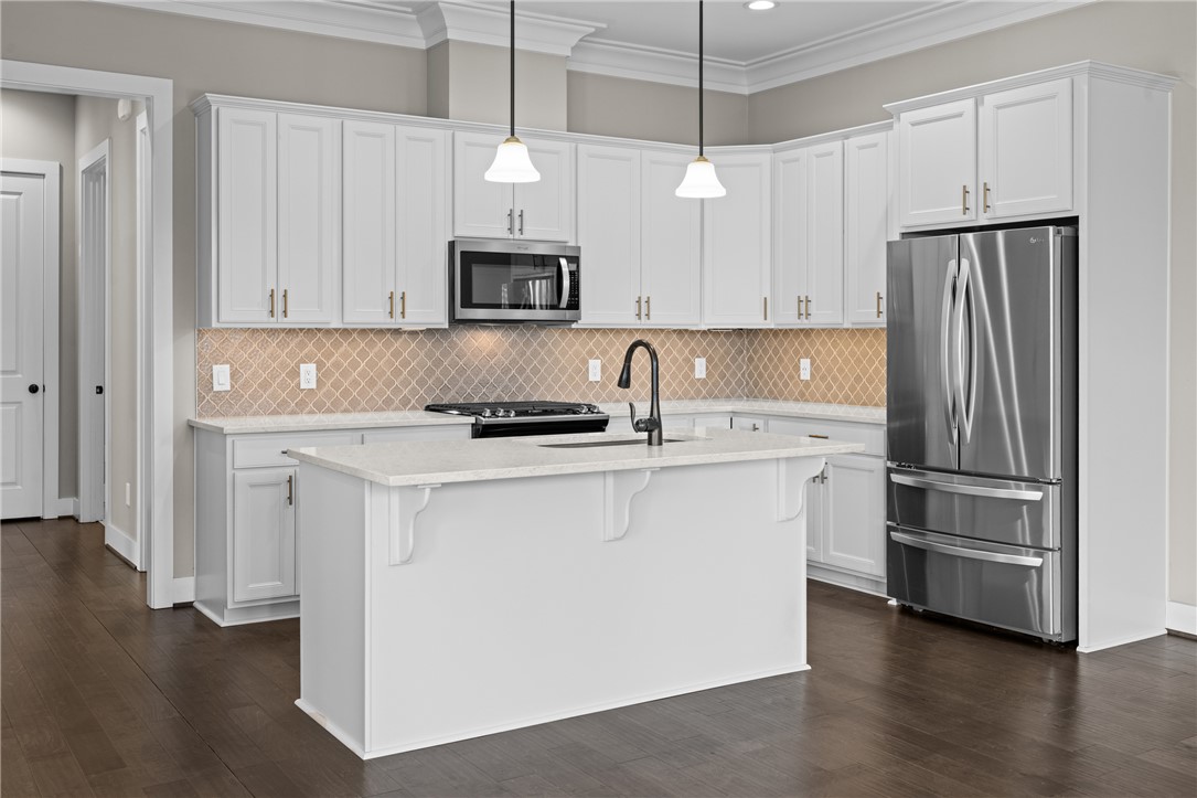 218 Tuttle Street Clemson, SC 29631 - Photo 6 of 20 Open kitchen for full connectivity to family and guests. Beautiful backsplash tile,