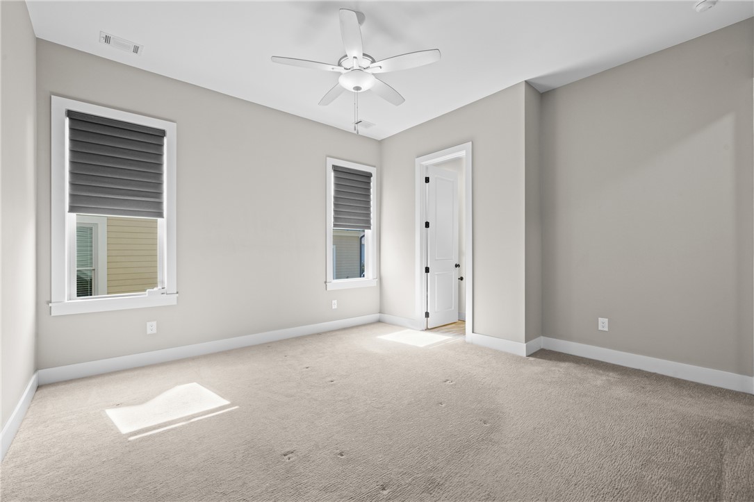 218 Tuttle Street Clemson, SC 29631 - Photo 10 of 20 Primary bedroom with remote control shades and ceiling fan.