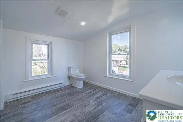 a bathroom with a toilet sink and bathtub