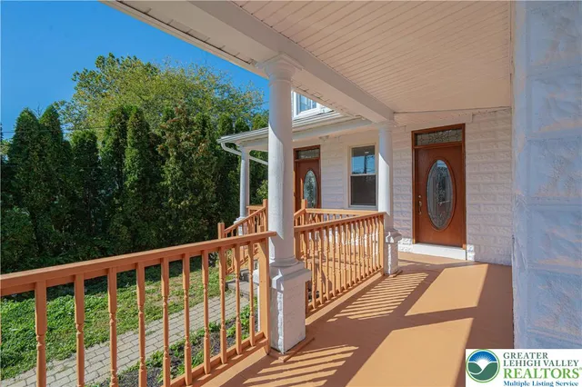 a view of a balcony with door