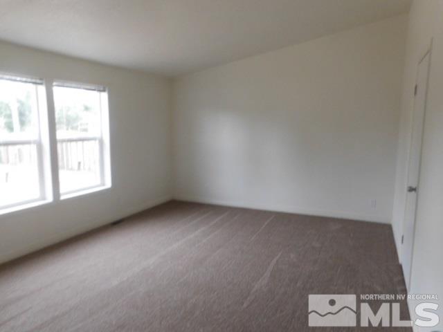 3860 Sandpiper Drive Reno, NV 89508 - Photo 5 of 7 an empty room with windows