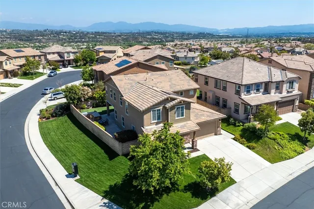 an aerial view of a house with a garden