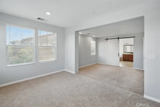 a spacious bathroom with a granite countertop tub sink and mirror