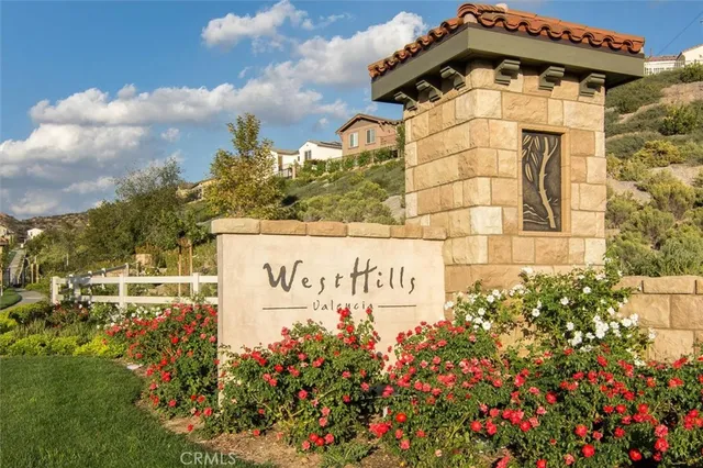 a view of a city with lots of residential buildings ocean and mountain view in back