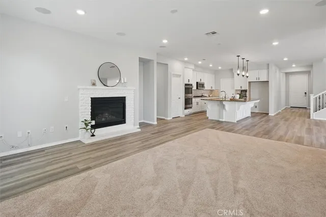 a view of a house with a yard and sitting area