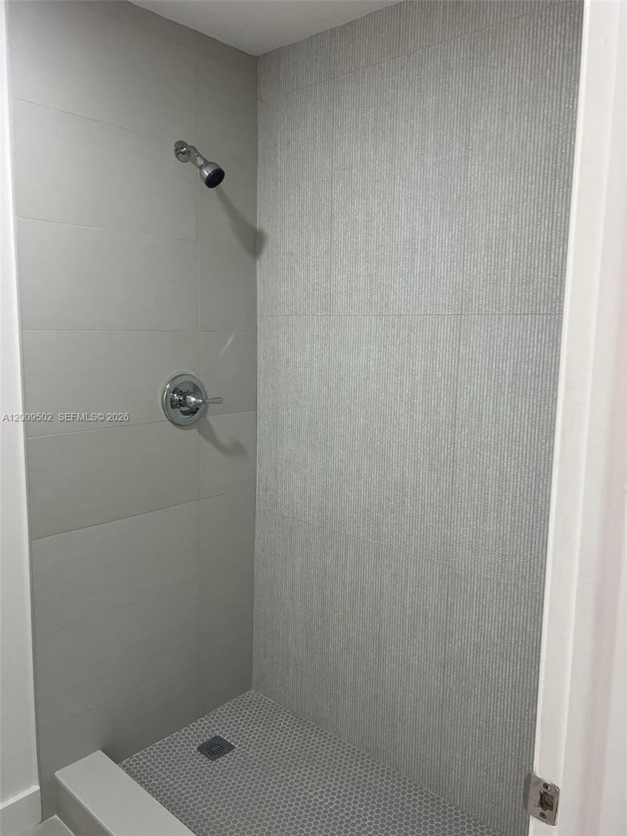 9203 Southwest 138th Place, Unit 9203 Miami, FL 33186 - Photo 12 of 22 a bathroom with a shower
