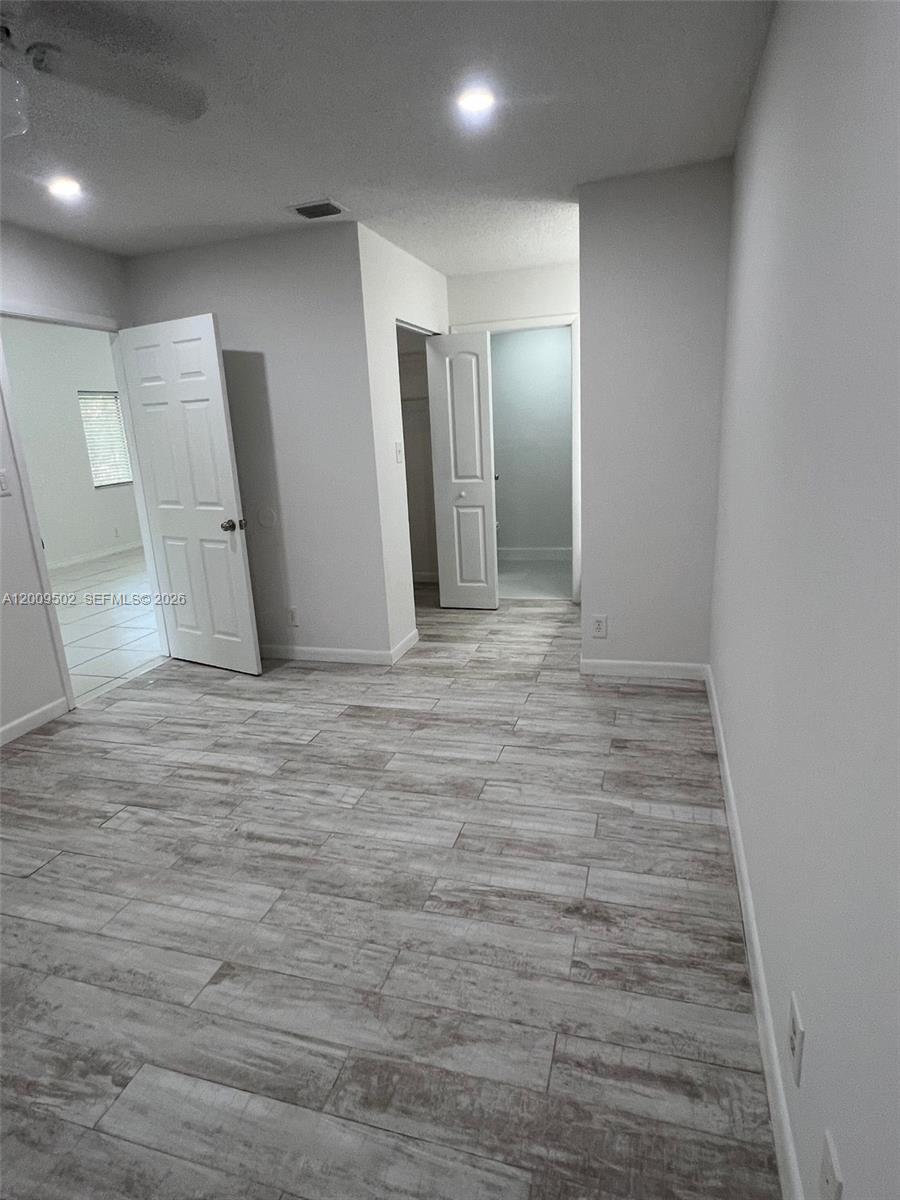 9203 Southwest 138th Place, Unit 9203 Miami, FL 33186 - Photo 2 of 22 a view of an empty room