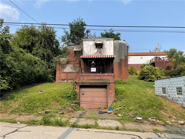 a view of a couches in front of house