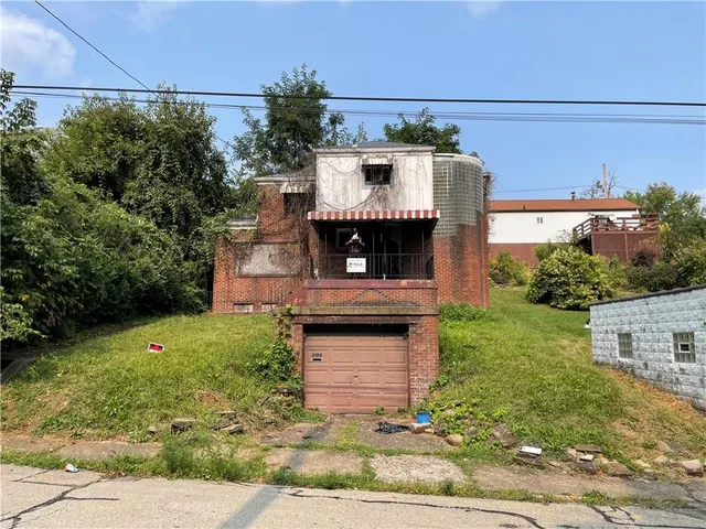 a view of a couches in front of house