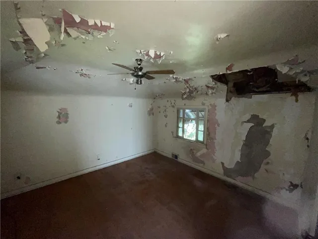 an empty room with a fireplace