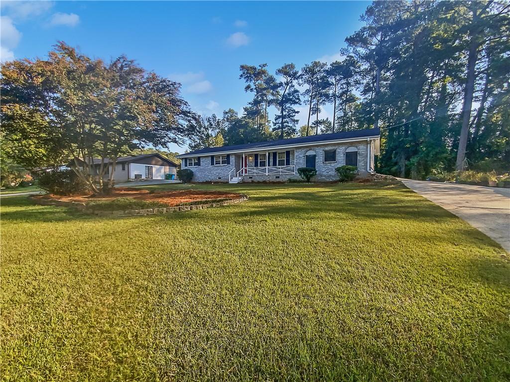 396 Arcadia Place Southwest Lilburn, GA 30047 - Photo 1 of 1 a view of a house with a swimming pool
