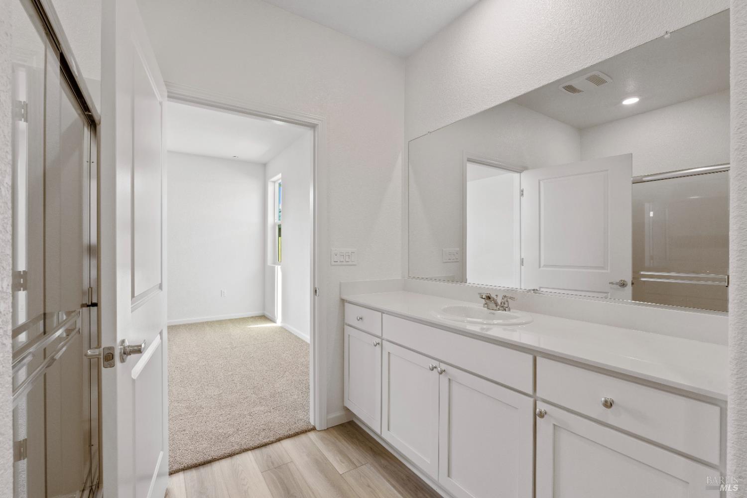 2261 Espana Lane Rio Vista, CA 94571 - Photo 17 of 20 a spacious bathroom with a granite countertop sink mirror and double