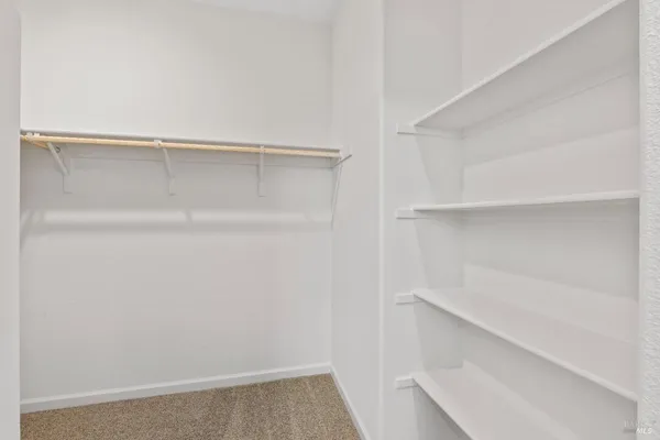 a view of an empty walk in closet