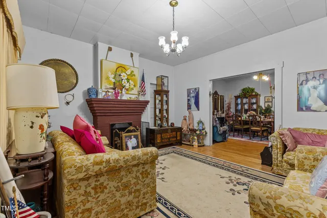 a view of a house with backyard porch and sitting area