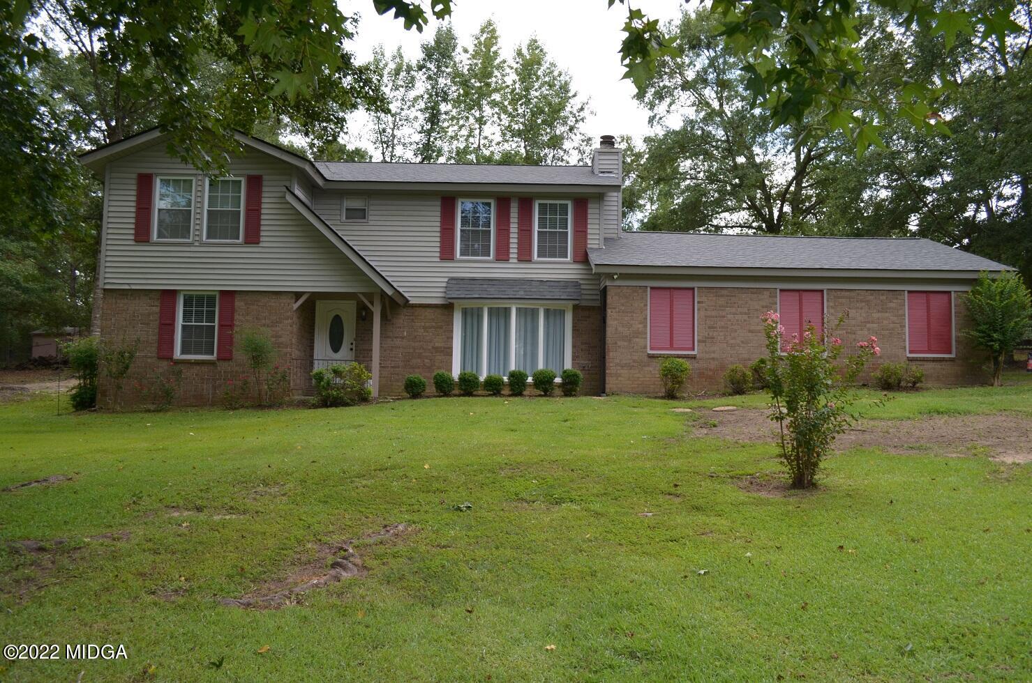 5760 Sardis Church Road Macon, GA 31216 - Photo 1 of 21 a front view of a house with a garden