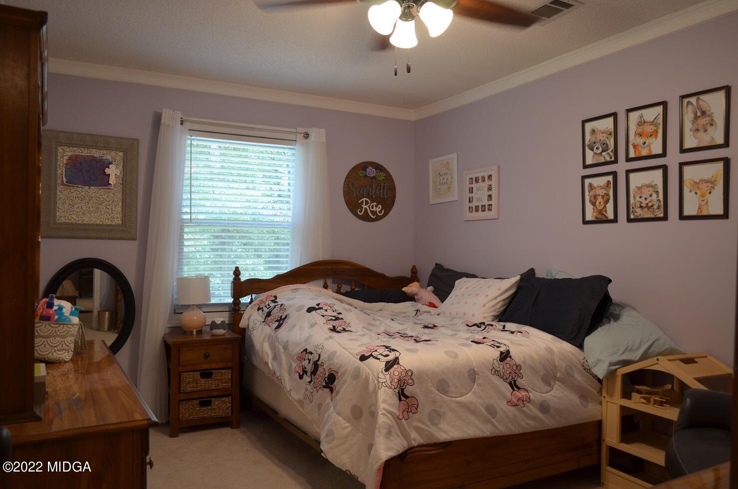 5760 Sardis Church Road Macon, GA 31216 - Photo 14 of 21 a bedroom with a bed and a window