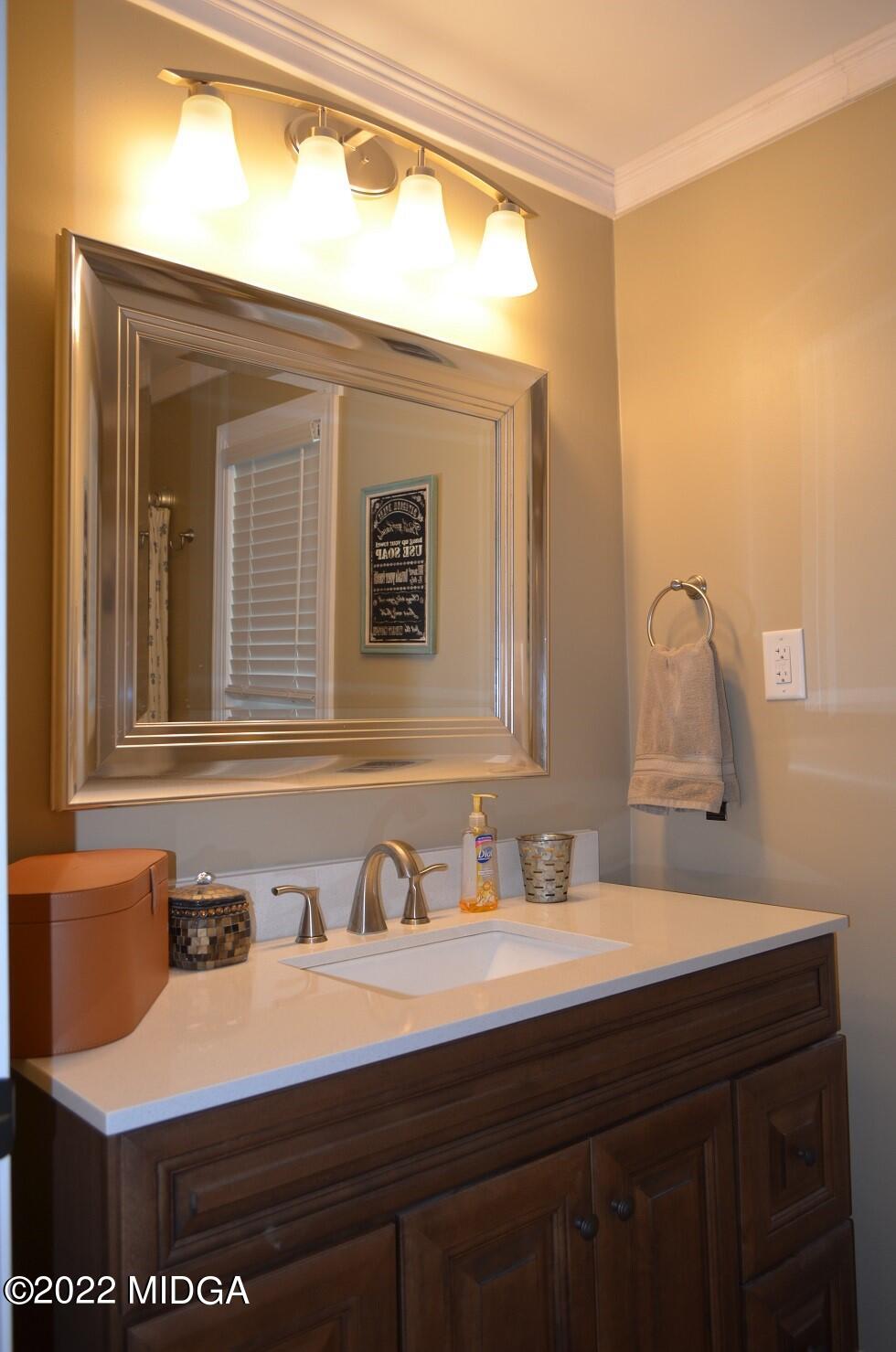 5760 Sardis Church Road Macon, GA 31216 - Photo 17 of 21 a bathroom with a sink and a mirror