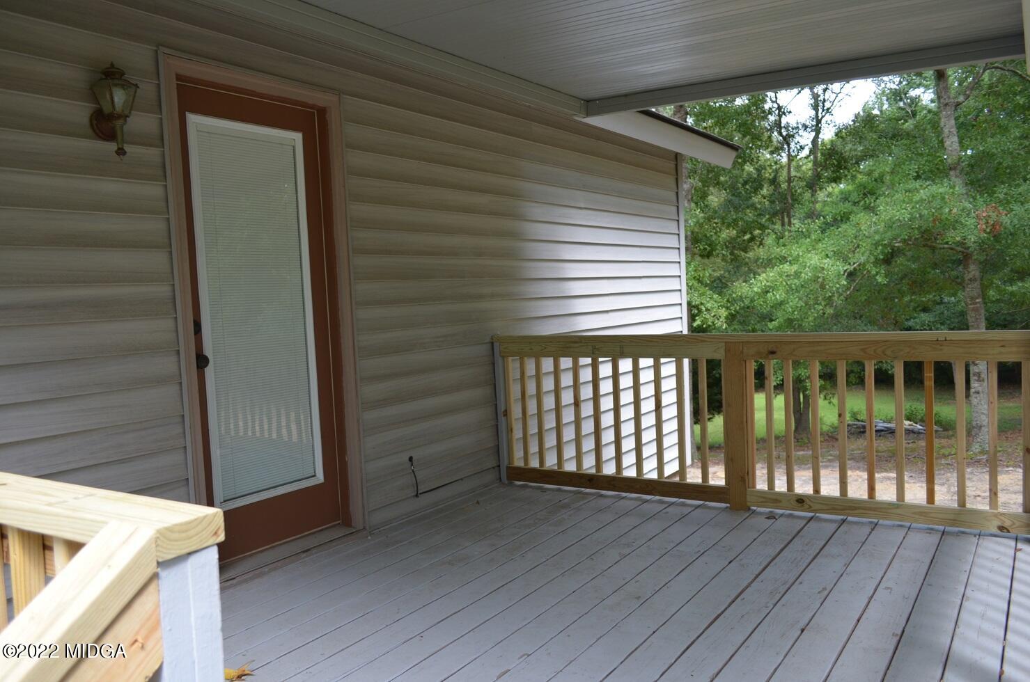 5760 Sardis Church Road Macon, GA 31216 - Photo 18 of 21 a view of a balcony with wooden floor