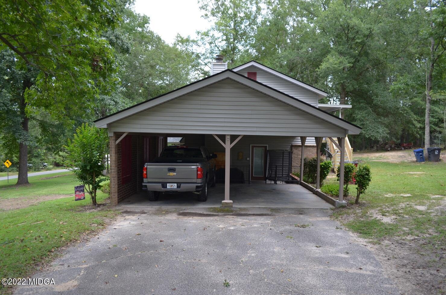 5760 Sardis Church Road Macon, GA 31216 - Photo 19 of 21 a view of a house that has a bunch of plants and trees