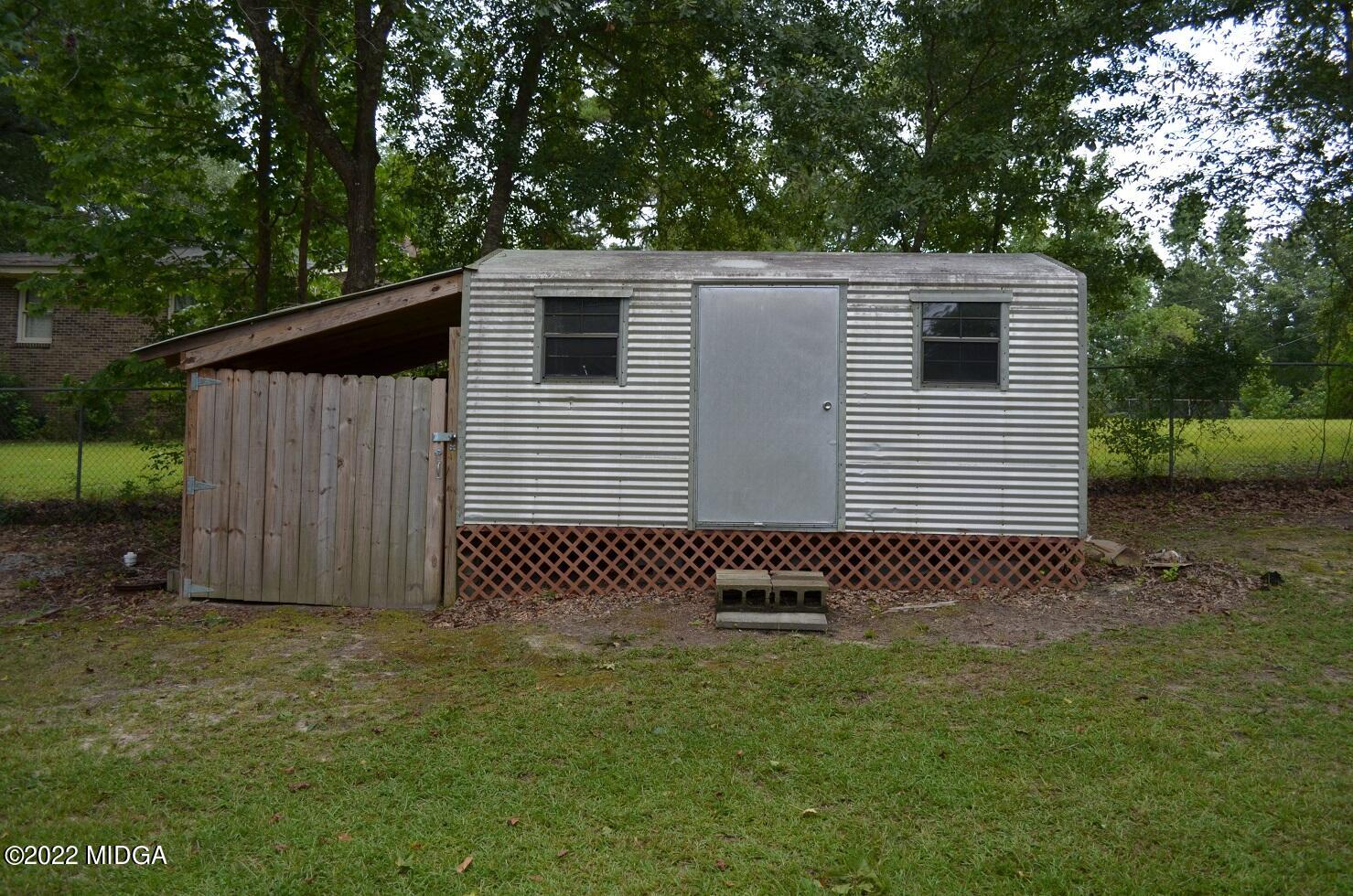 5760 Sardis Church Road Macon, GA 31216 - Photo 20 of 21 a backyard of a house with lots of green space