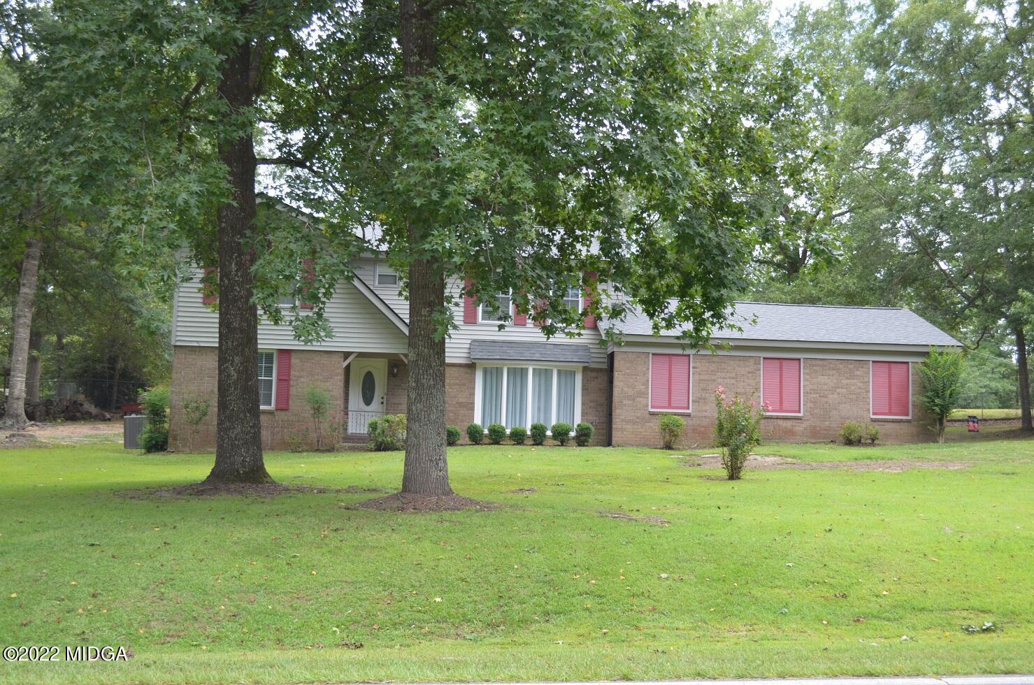 5760 Sardis Church Road Macon, GA 31216 - Photo 2 of 21 a house view with a sitting space and garden