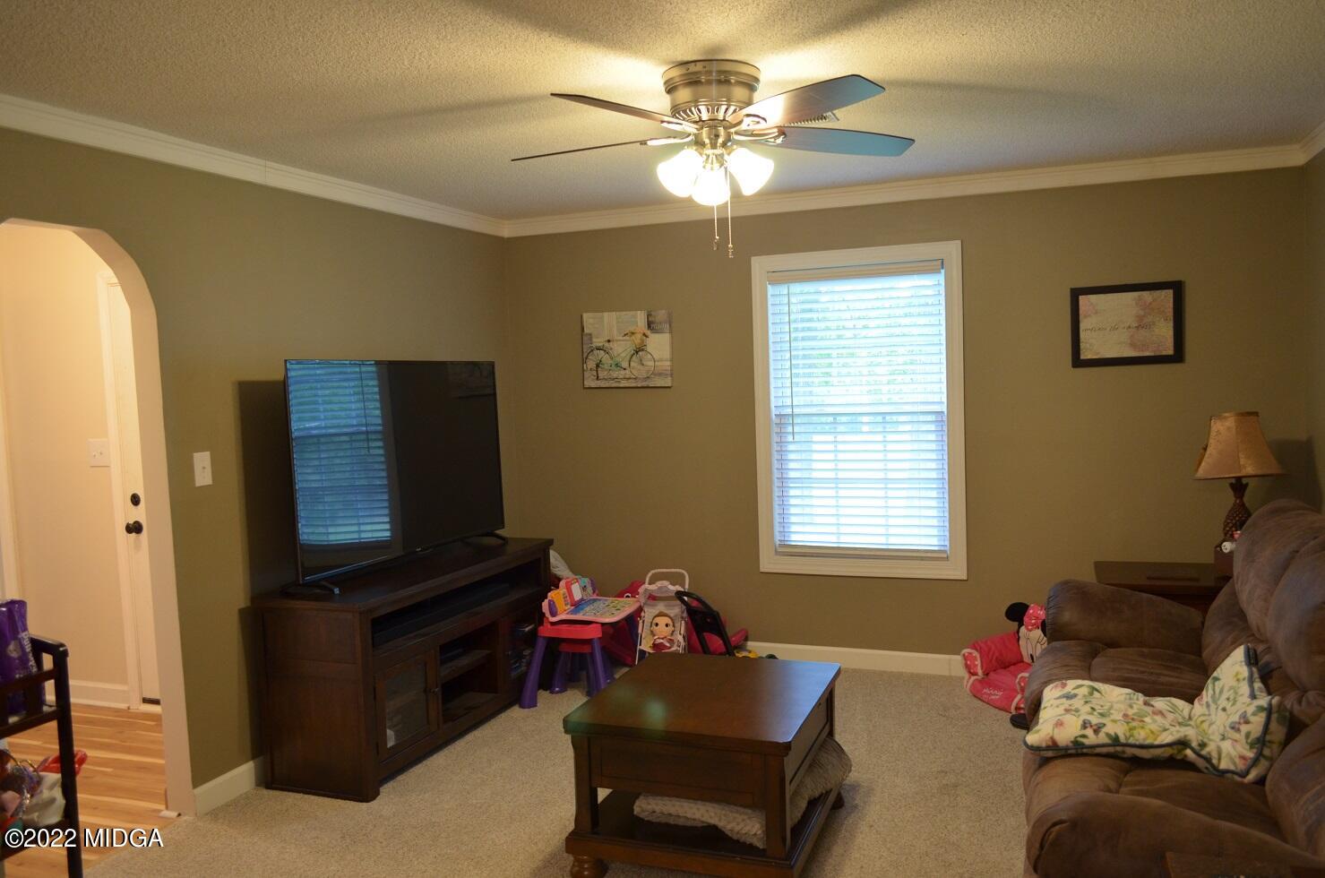5760 Sardis Church Road Macon, GA 31216 - Photo 4 of 21 a living room with furniture and a flat screen tv