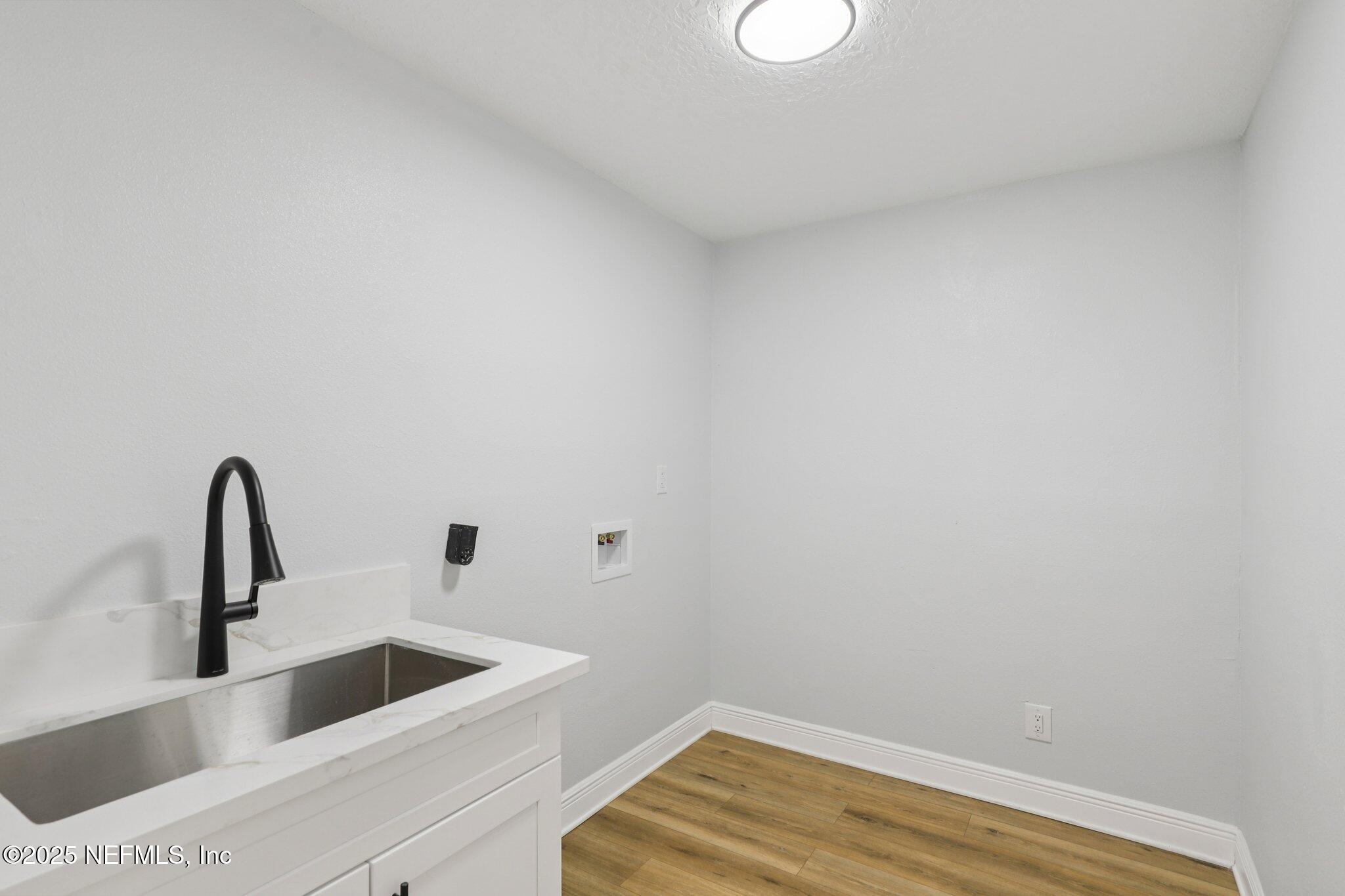 12305 Del Rio Drive Jacksonville, FL 32258 - Photo 44 of 75 Inside Laundry w/farmhouse sink cabinet