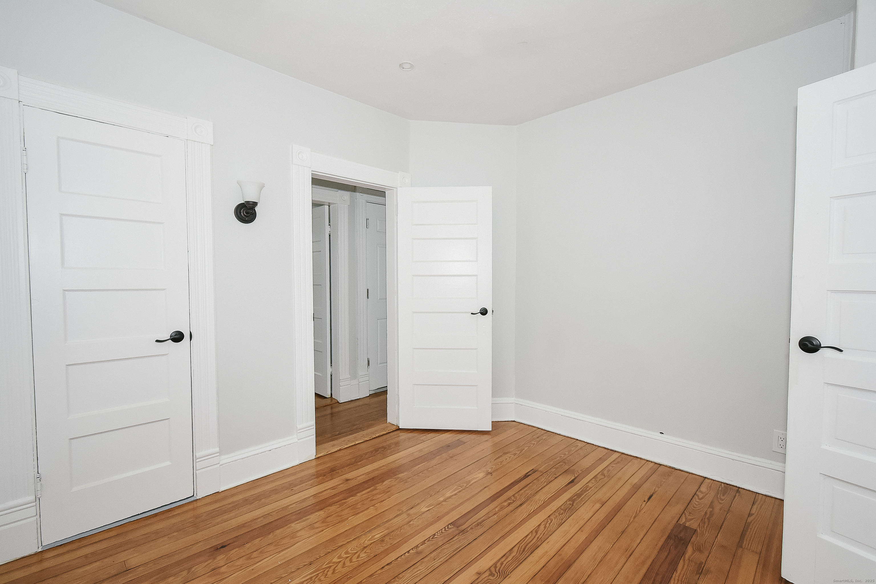 22 Kelley Street Bristol, CT 06010 - Photo 17 of 19 wooden floor in an empty room