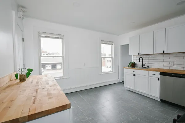a kitchen with sink and window