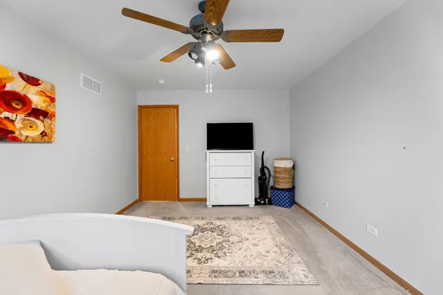 a living room with a couch and a chandelier
