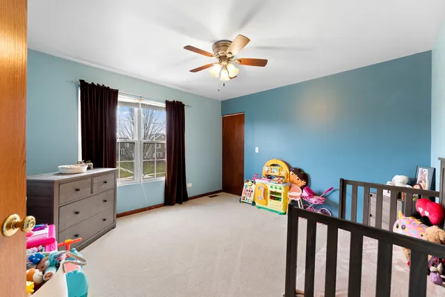 a bedroom with furniture and a window