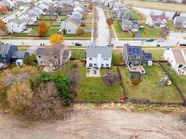 an aerial view of a houses with outdoor space