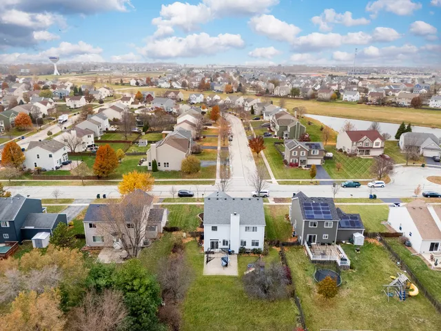 an aerial view of residential houses with outdoor space