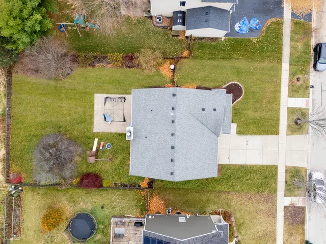 an aerial view of residential houses with outdoor space