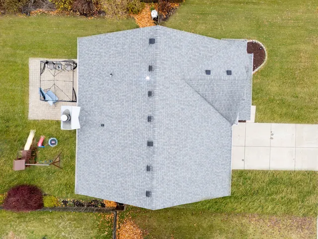 a view of a swimming pool with a yard