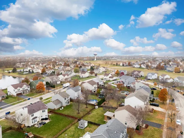 an aerial view of a city with lots of residential buildings