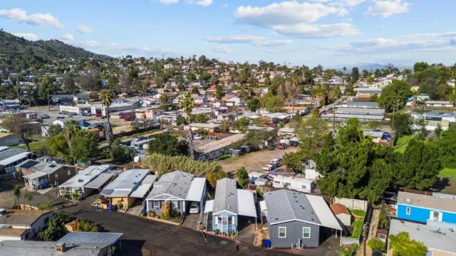 an aerial view of residential houses with outdoor space