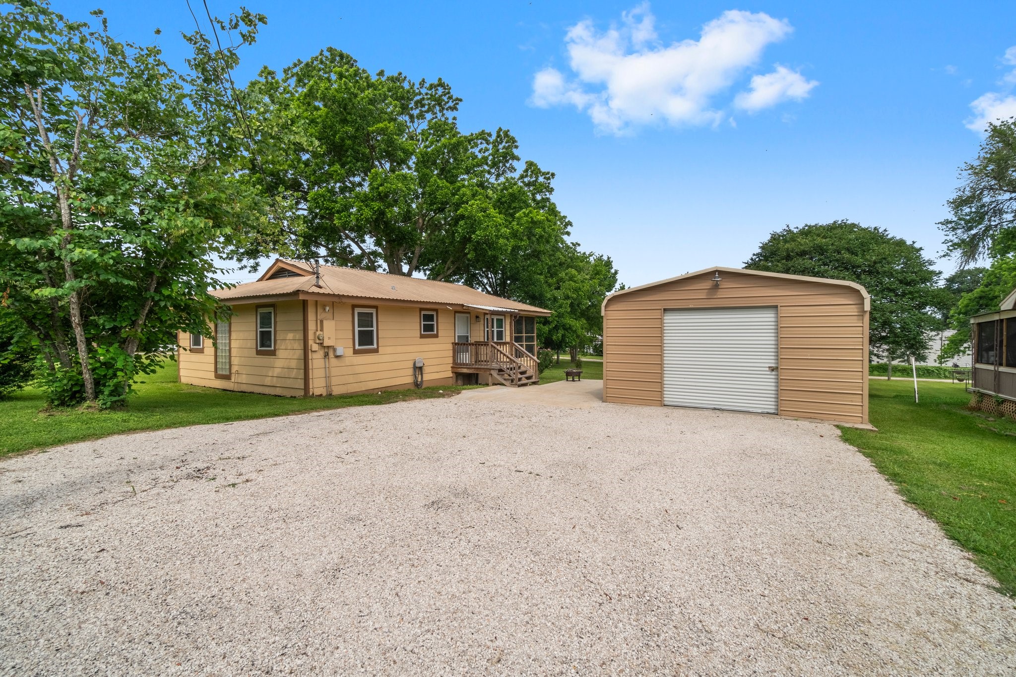 21 Clearview Point Blank, TX 77364 - Photo 2 of 43 a front view of house with yard and trees in the background