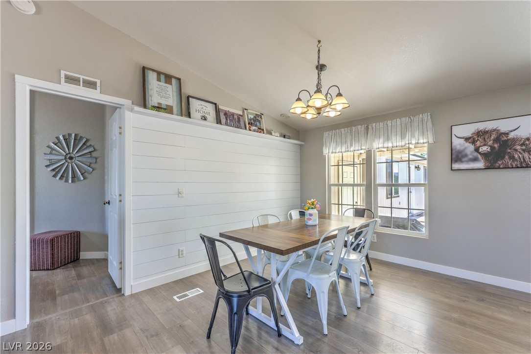 348 Tres Palomas Street Overton, NV 89040 - Photo 10 of 41 A charming dining space with rustic accents and ample natural light from generous windows.