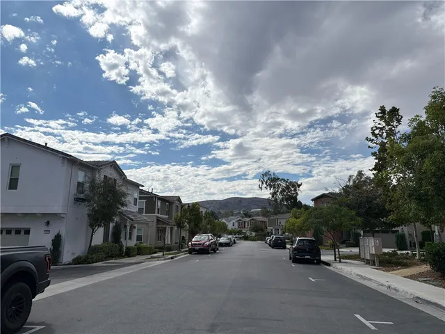 a view of a cars parked in front of a house